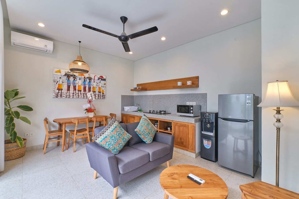 Deluxe Villa | Living area | 50-inch flat-screen TV with digital channels