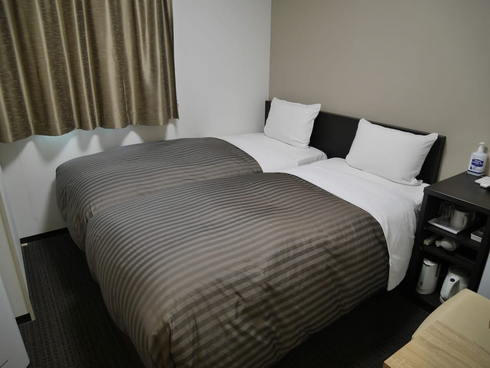 Down comforters, desk, free WiFi, bed sheets