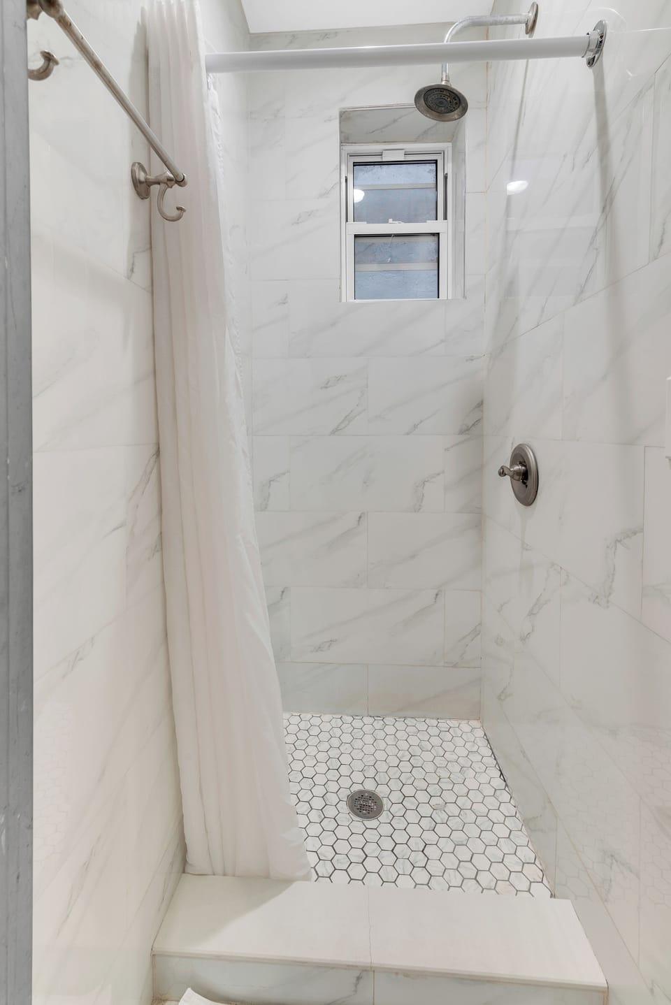 Shower, rainfall showerhead, designer toiletries, hair dryer