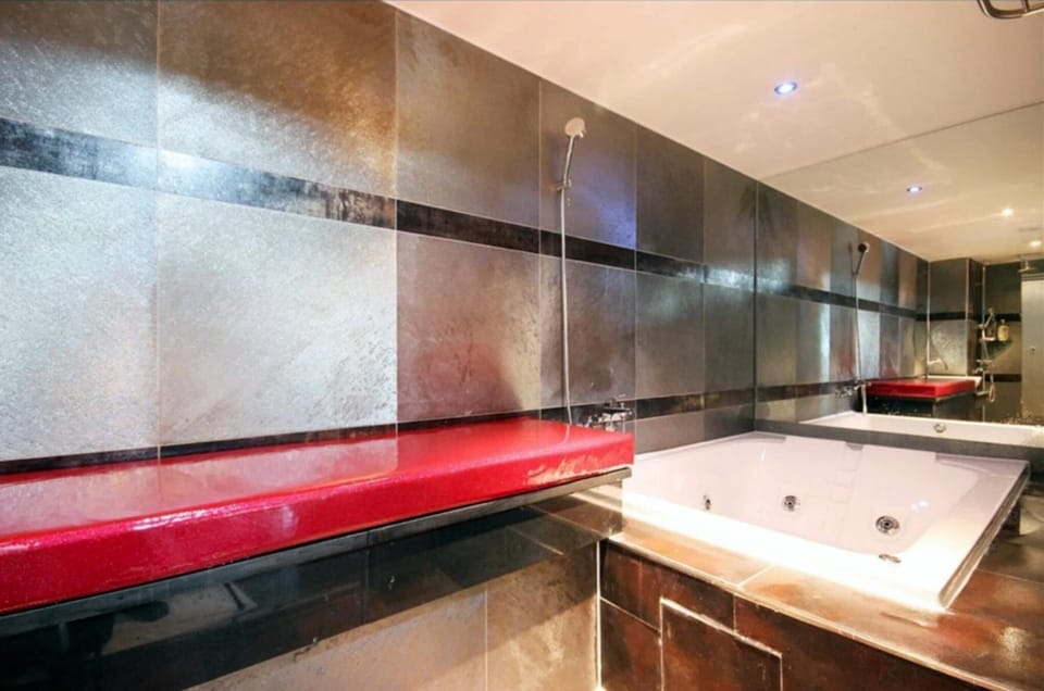 Combined shower/tub, designer toiletries, hair dryer, bathrobes