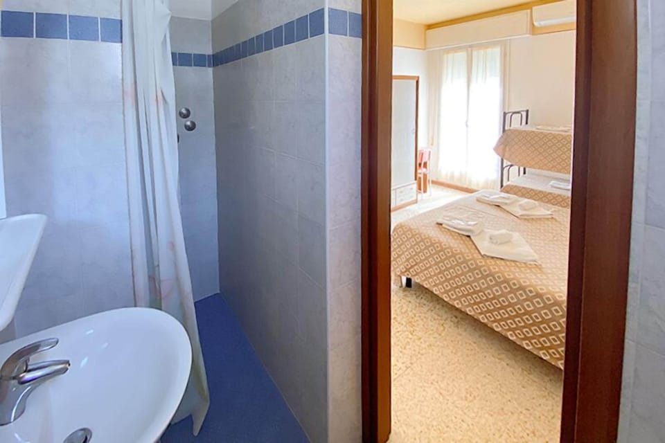 Standard Quadruple Room, Balcony | Bathroom | Shower, rainfall showerhead, free toiletries, hair dryer