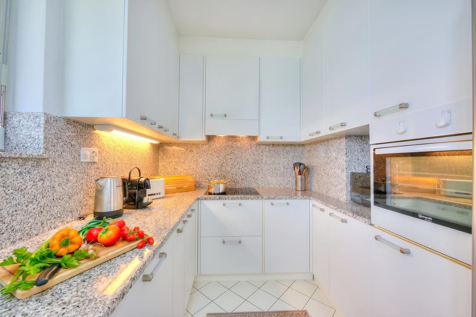 Family Apartment, 2 Bedrooms, Refrigerator & Microwave, Mountainside (Residenza Parco Carona) | Private kitchen | Stovetop, espresso maker, electric kettle