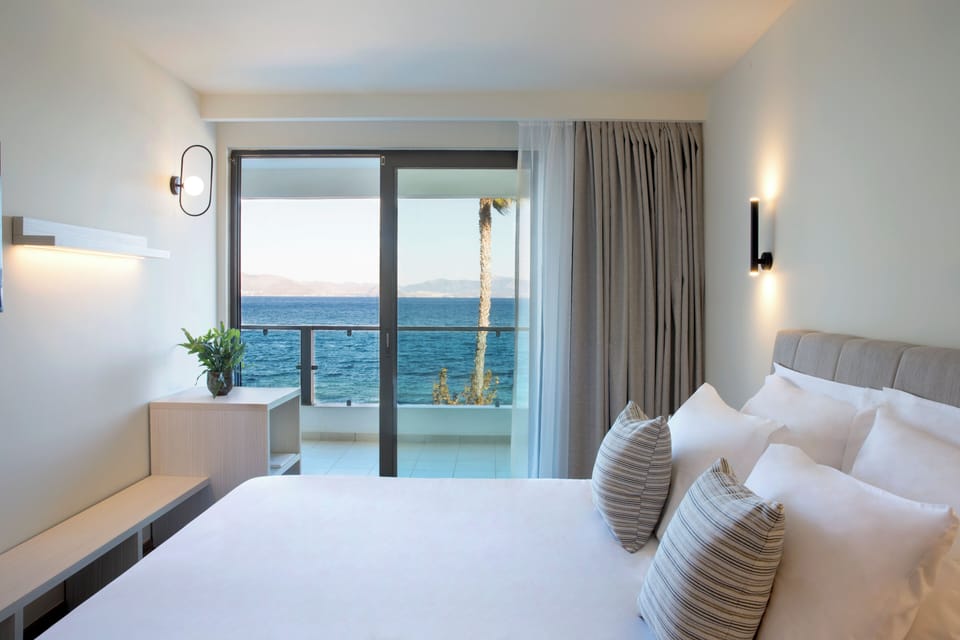 Family Room, 1 Bedroom, Sea View | In-room safe, desk, laptop workspace, blackout drapes