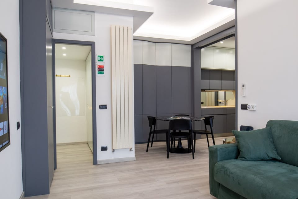Deluxe Studio Suite | Living area | Flat-screen TV