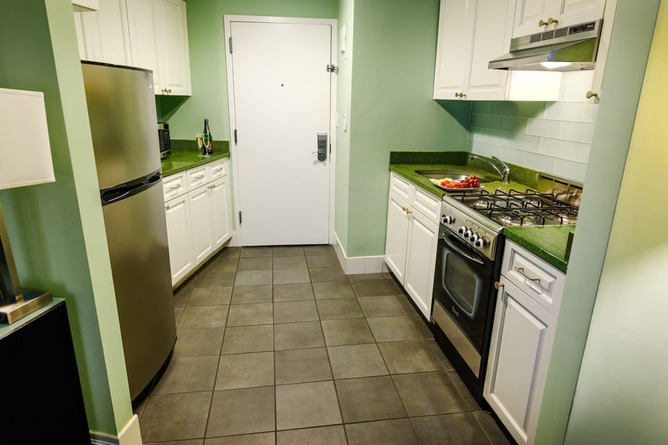 Suite, 2 Bedrooms | Private kitchen | Fridge, microwave, stovetop, coffee/tea maker