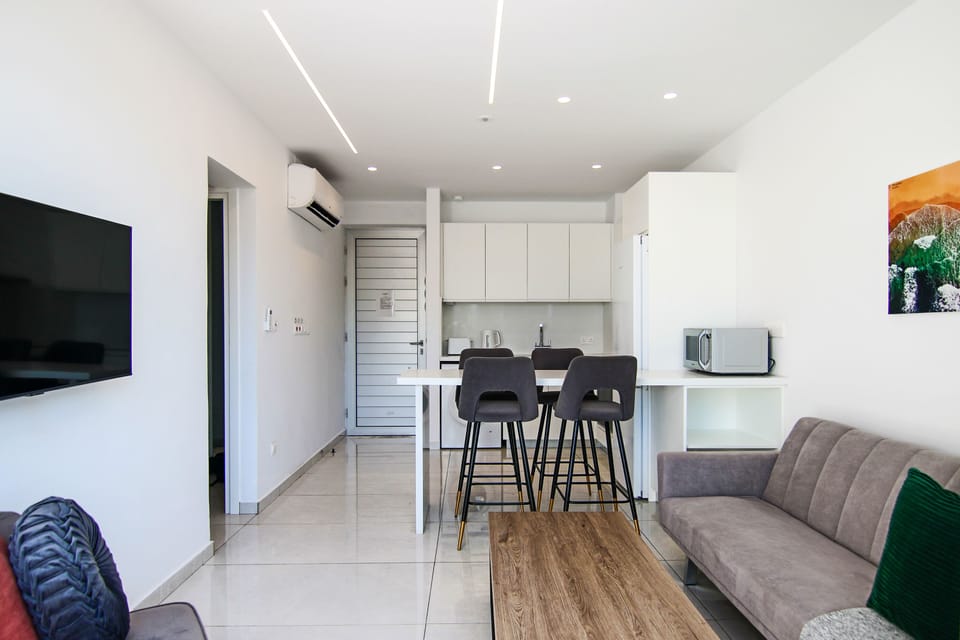 Executive Apartment | Living area | TV