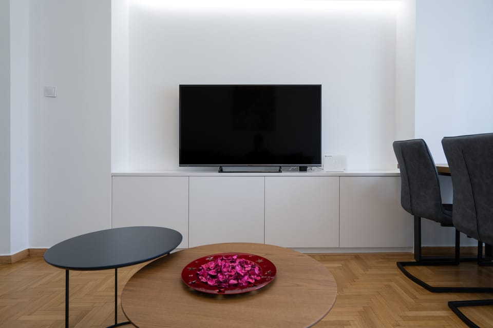 Design Apartment, City View | Living area | 62-inch Smart TV with cable channels, TV