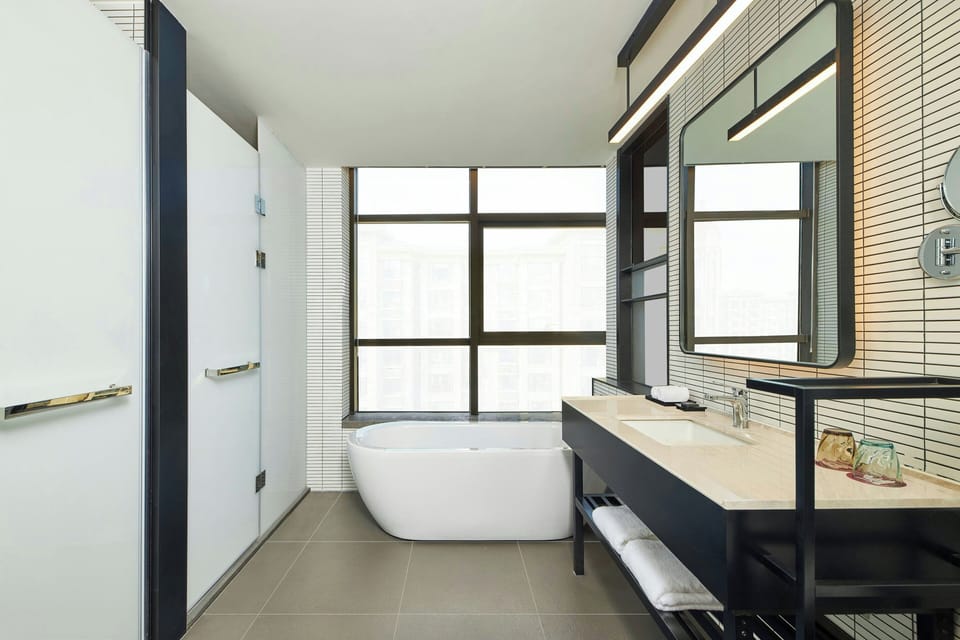 aloft, Suite, 1 Bedroom, City View | Bathroom | Free toiletries, hair dryer, slippers, towels