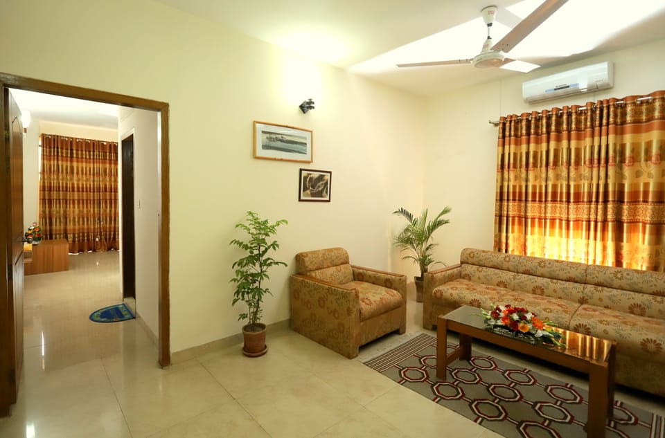 Deluxe Suite, City View | Living area | 32-inch LED TV with cable channels, TV