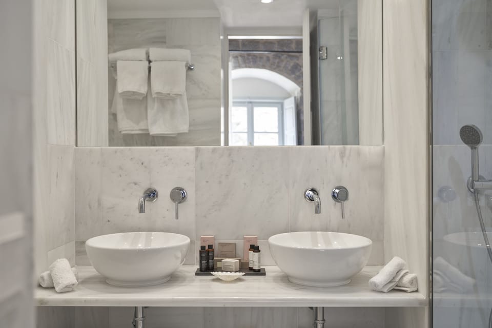 Cove Suite | Bathroom | Shower, hydromassage showerhead, designer toiletries, hair dryer