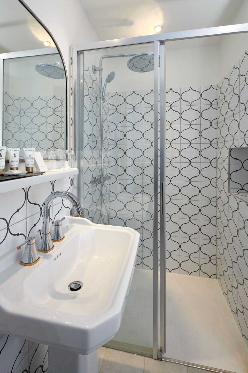 Deluxe Room | Bathroom | Rainfall showerhead, designer toiletries, hair dryer, bathrobes