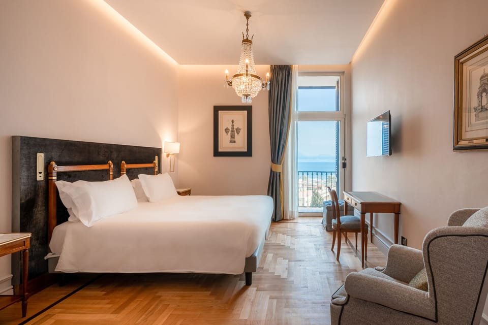 Deluxe Room, 1 King Bed, Sea View | Premium bedding, minibar, in-room safe, individually decorated