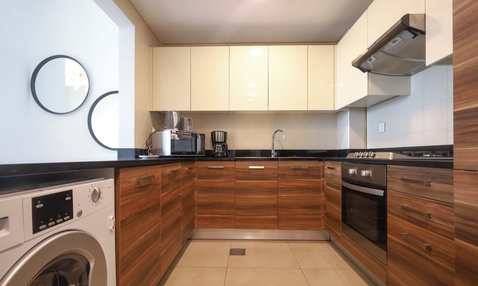 Luxury Apartment | Private kitchen | Full-size fridge, microwave, oven, coffee/tea maker