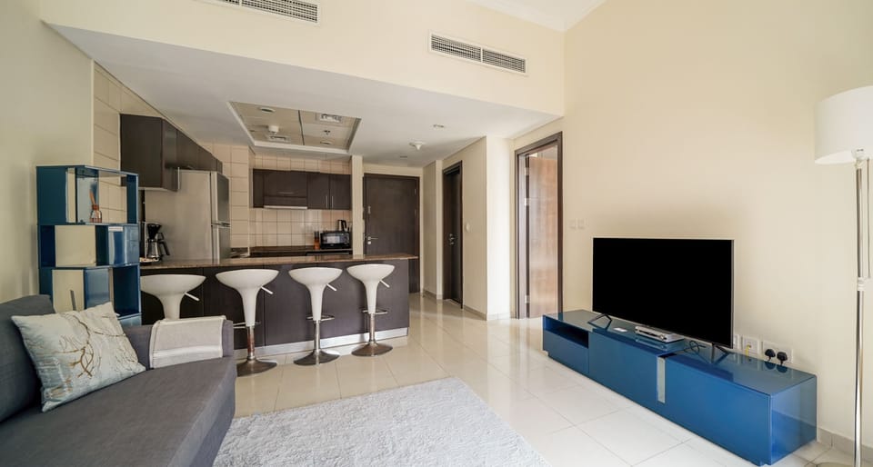 Luxury Apartment | Living area | 43-inch Smart TV with cable channels, TV