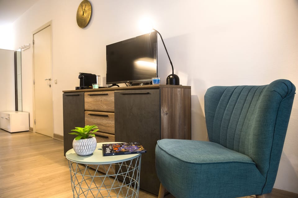 Comfort Apartment | Living area | TV