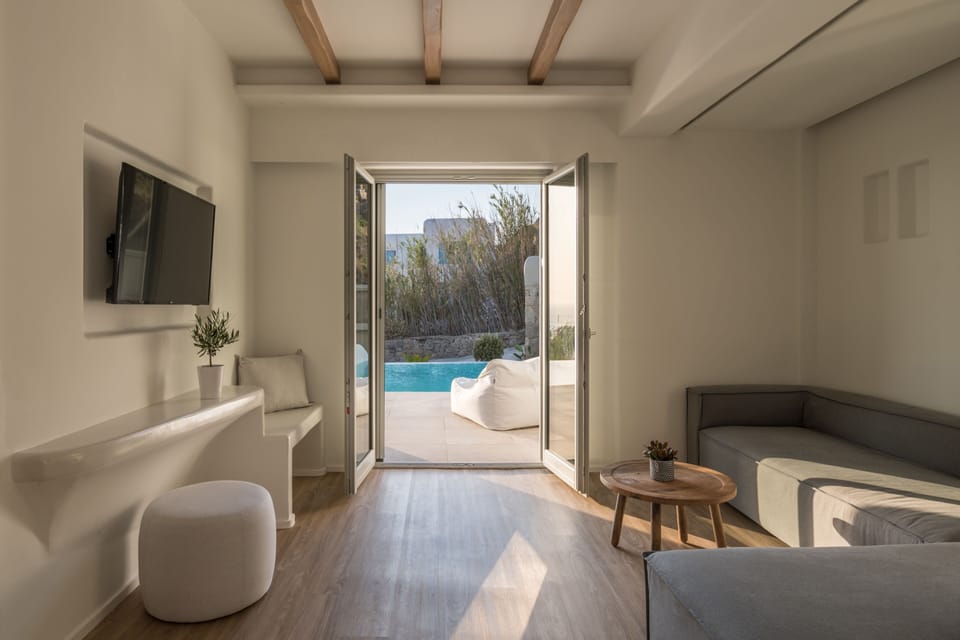 Honeymoon Suite with pool | Living area | 43-inch flat-screen TV with digital channels, TV