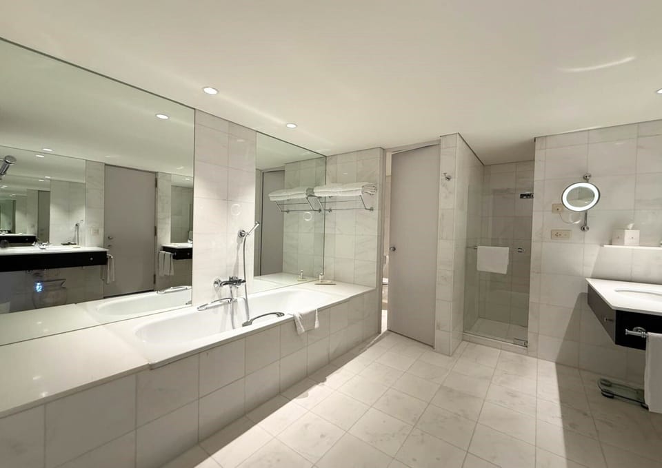 Executive Suite | Bathroom | Designer toiletries, hair dryer, bathrobes, slippers