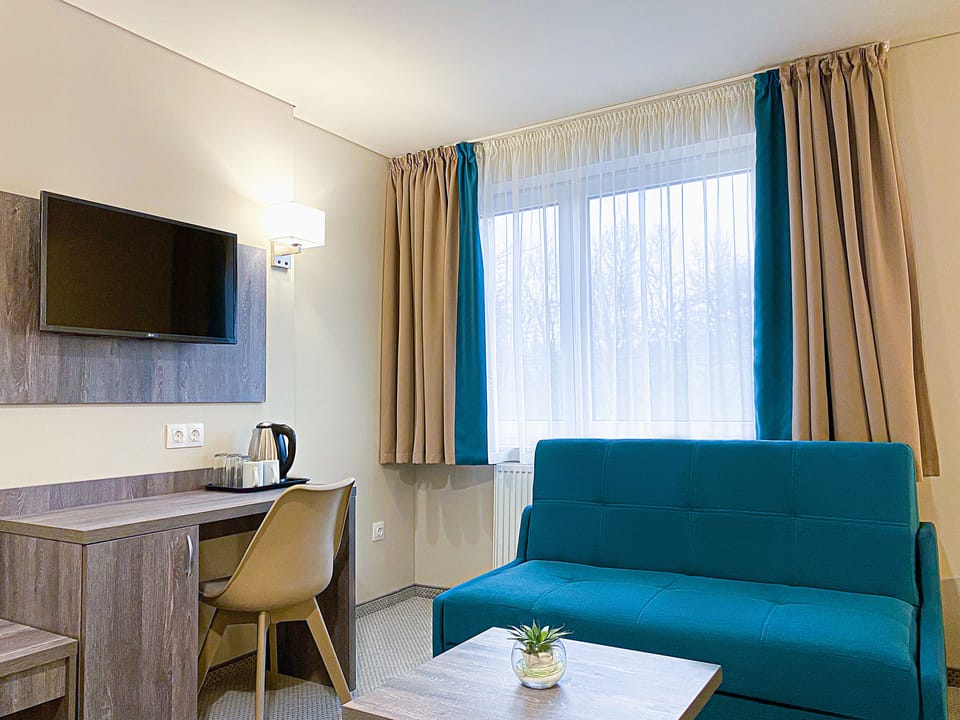 Desk, laptop workspace, free WiFi, bed sheets