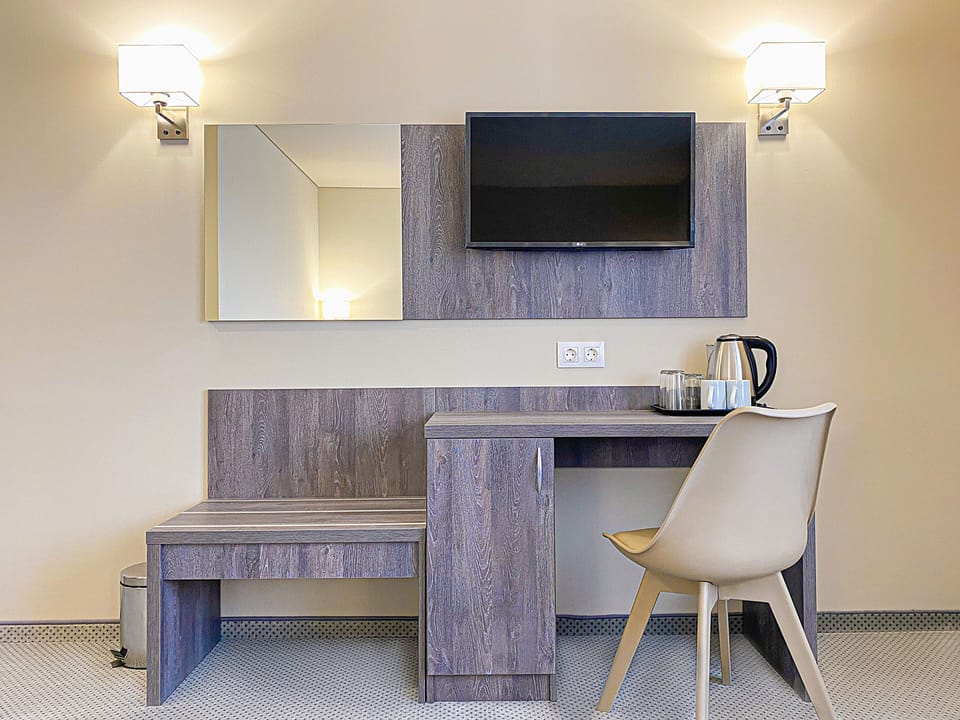 Desk, laptop workspace, free WiFi, bed sheets