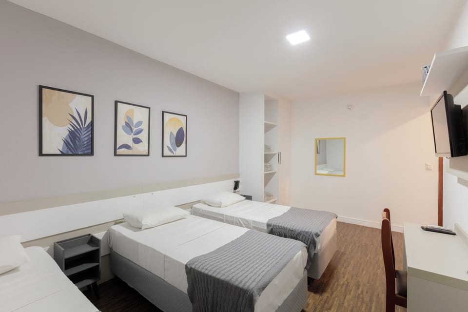Triple Room | Minibar, desk, blackout drapes, free WiFi