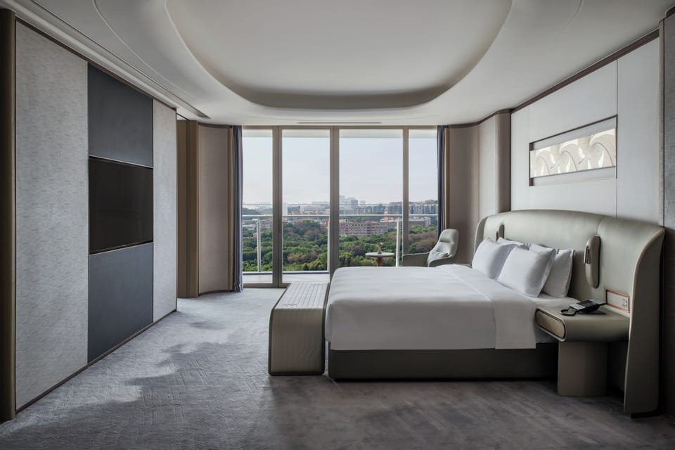 Premium bedding, down comforters, free minibar items, in-room safe