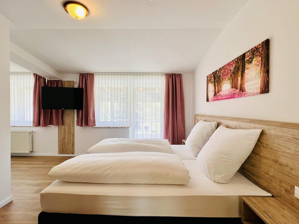 Family Quadruple Room | Hypo-allergenic bedding, desk, blackout drapes, iron/ironing board
