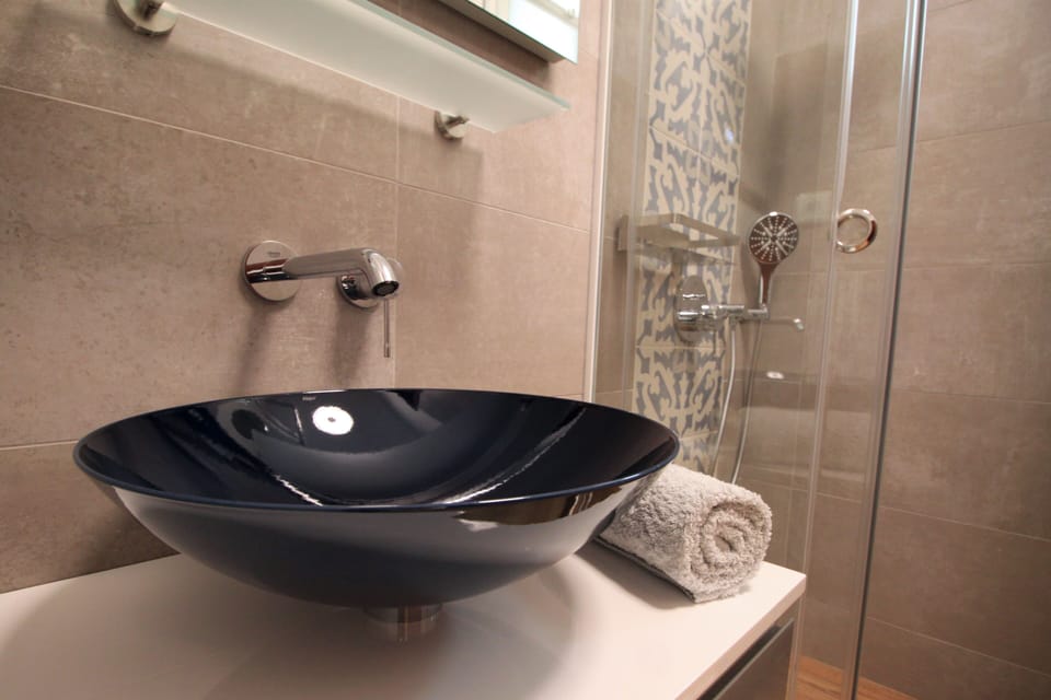 Shower, rainfall showerhead, eco-friendly toiletries, hair dryer