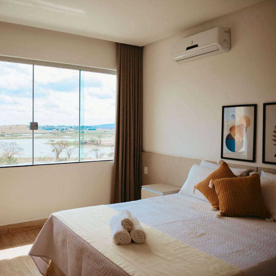Deluxe Double Room | Minibar, desk, laptop workspace, blackout drapes