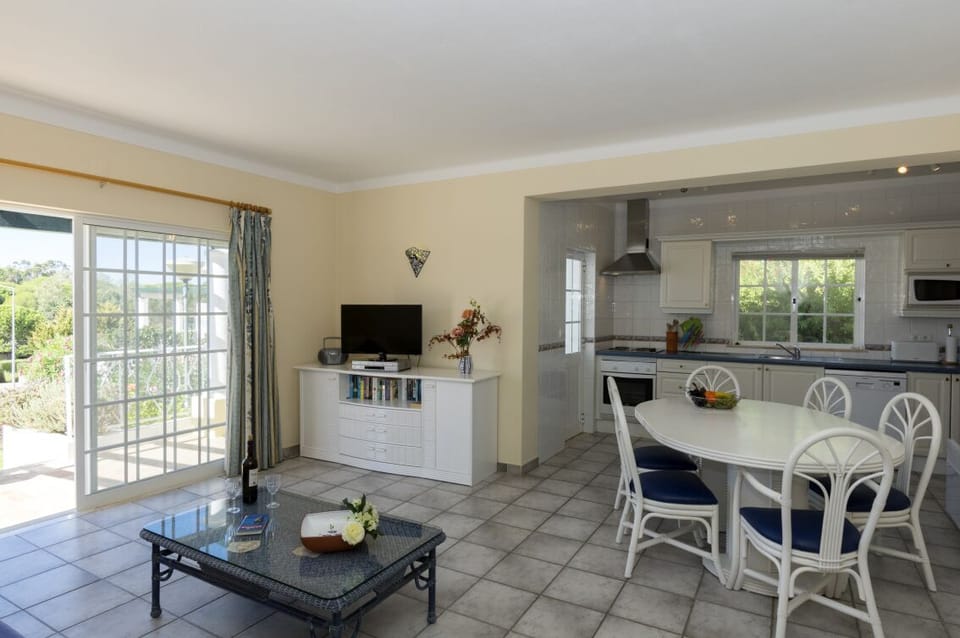 Three-bedroom Villa with Garden View | Living area | 32-inch flat-screen TV with satellite channels, DVD player