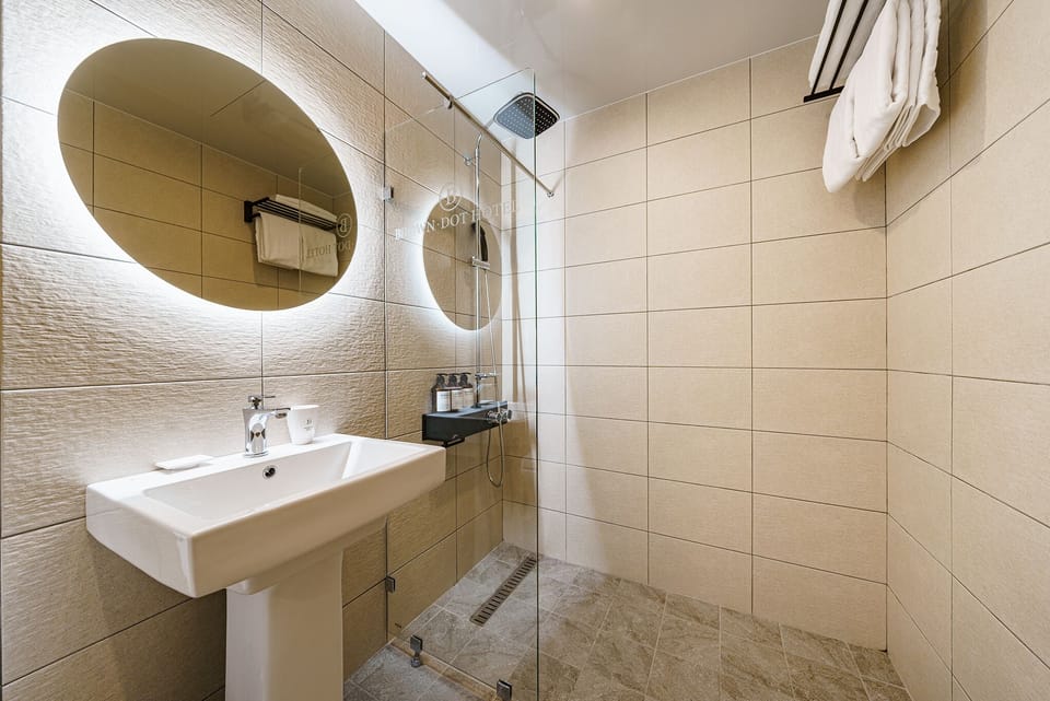 Economy Double Room, Non Smoking | Bathroom | Shower, free toiletries, hair dryer, bathrobes