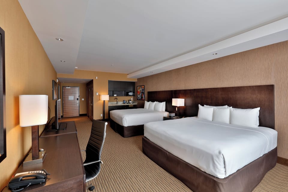 Deluxe Room, Multiple Beds | Desk, laptop workspace, blackout drapes, soundproofing