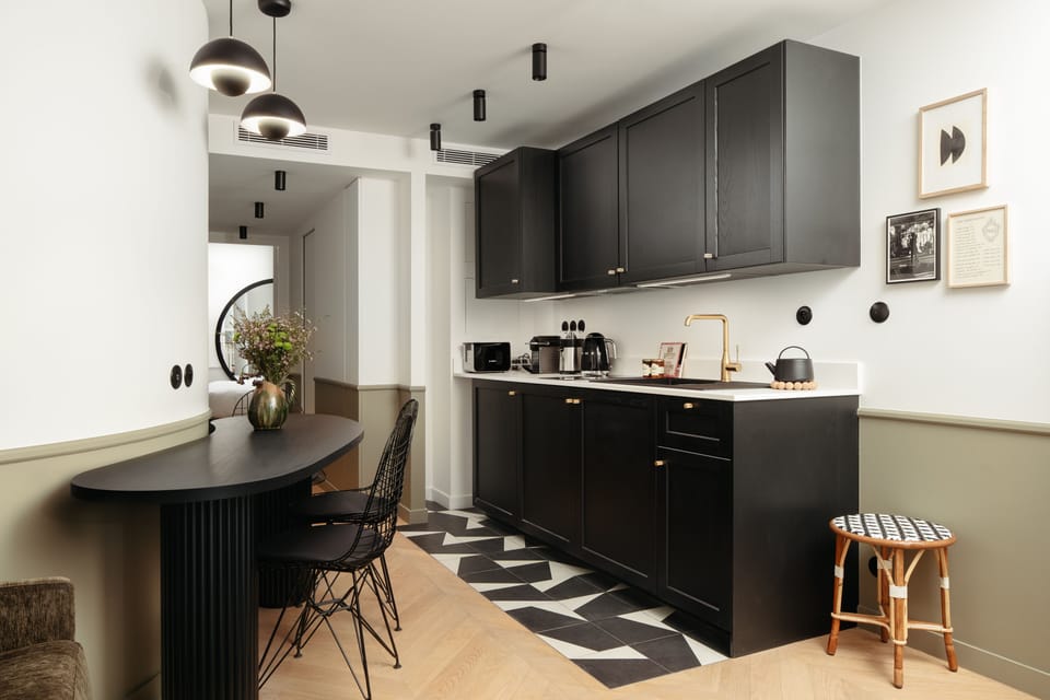 Deluxe Apartment | Private kitchen | Espresso maker, coffee/tea maker, electric kettle, dining tables