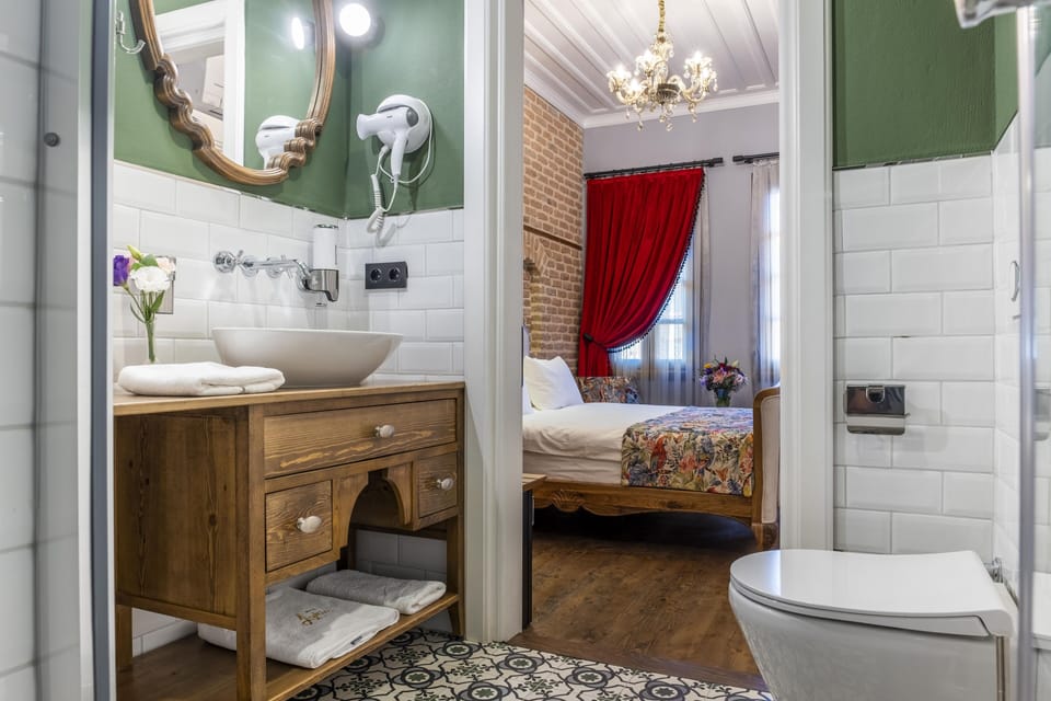 Standard Suite, 1 Queen Bed with Sofa bed | Bathroom | Shower, slippers, towels
