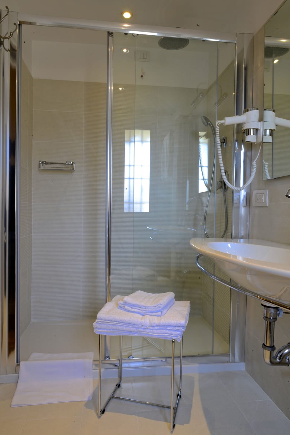 Shower, rainfall showerhead, designer toiletries, hair dryer