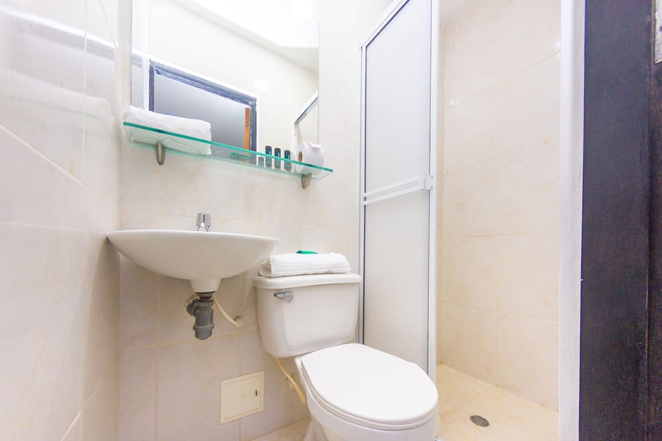 Double Room | Bathroom | Shower, free toiletries, towels, soap