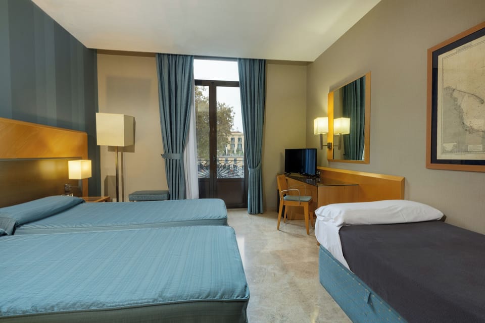 Triple Room | In-room safe, desk, laptop workspace, blackout drapes