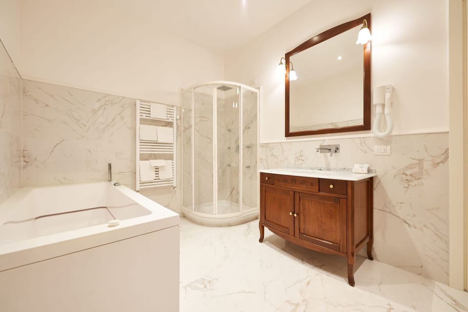 Suite, 1 Bedroom | Bathroom | Shower, hair dryer, bidet, towels