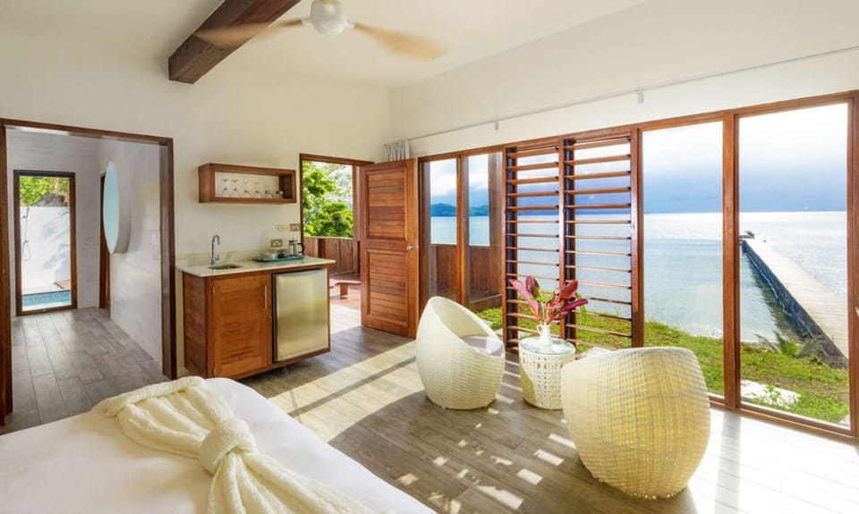 Oceanfront Retreat | Premium bedding, minibar, in-room safe, blackout drapes