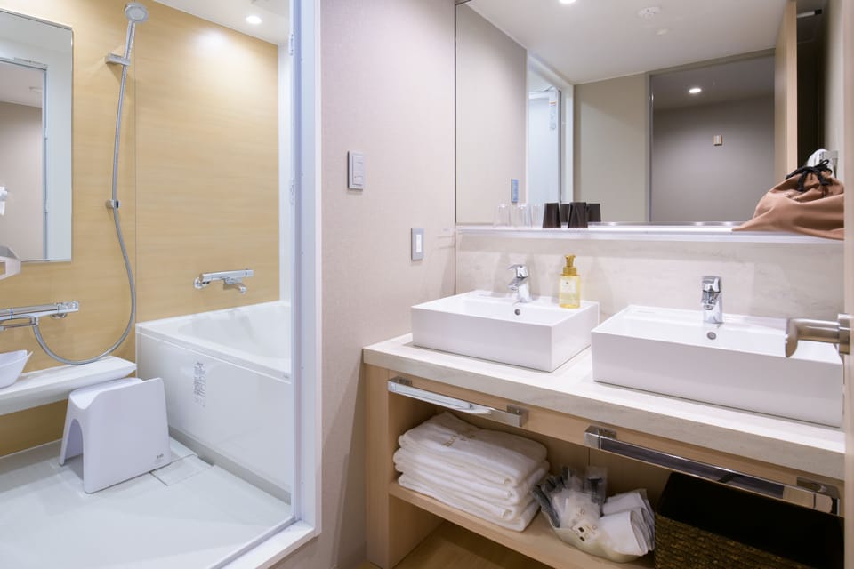 Combined shower/tub, free toiletries, hair dryer, slippers