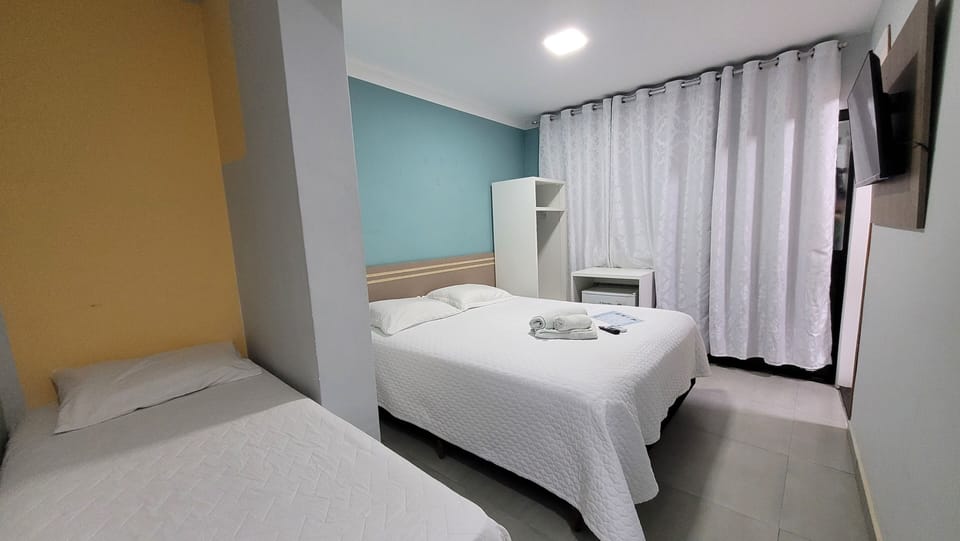 Triple Room | Minibar, individually decorated, desk, laptop workspace