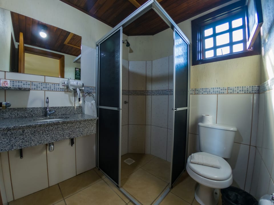 Shower, rainfall showerhead, hair dryer, towels