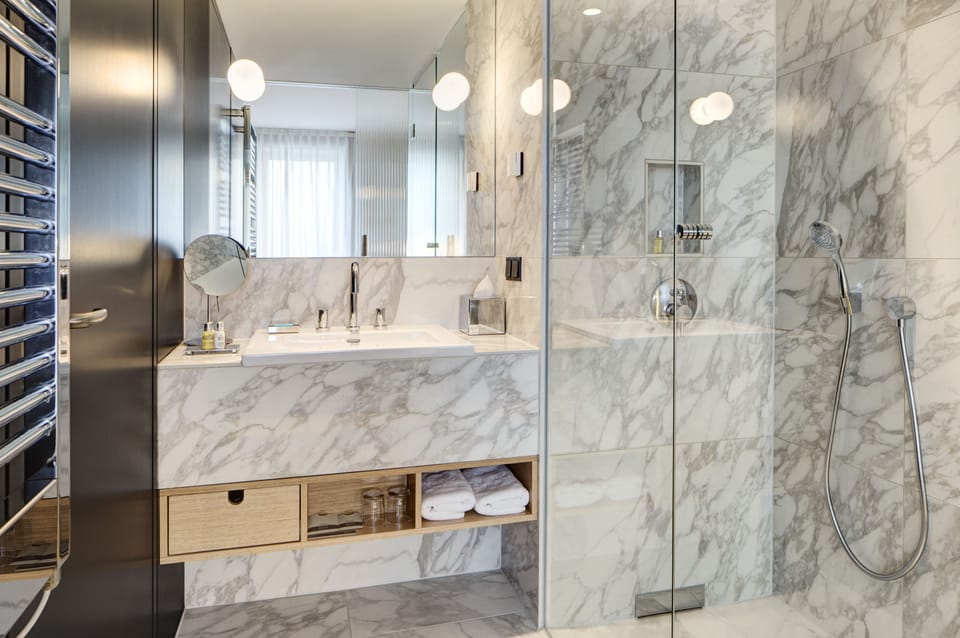 Designer toiletries, hair dryer, bathrobes, slippers