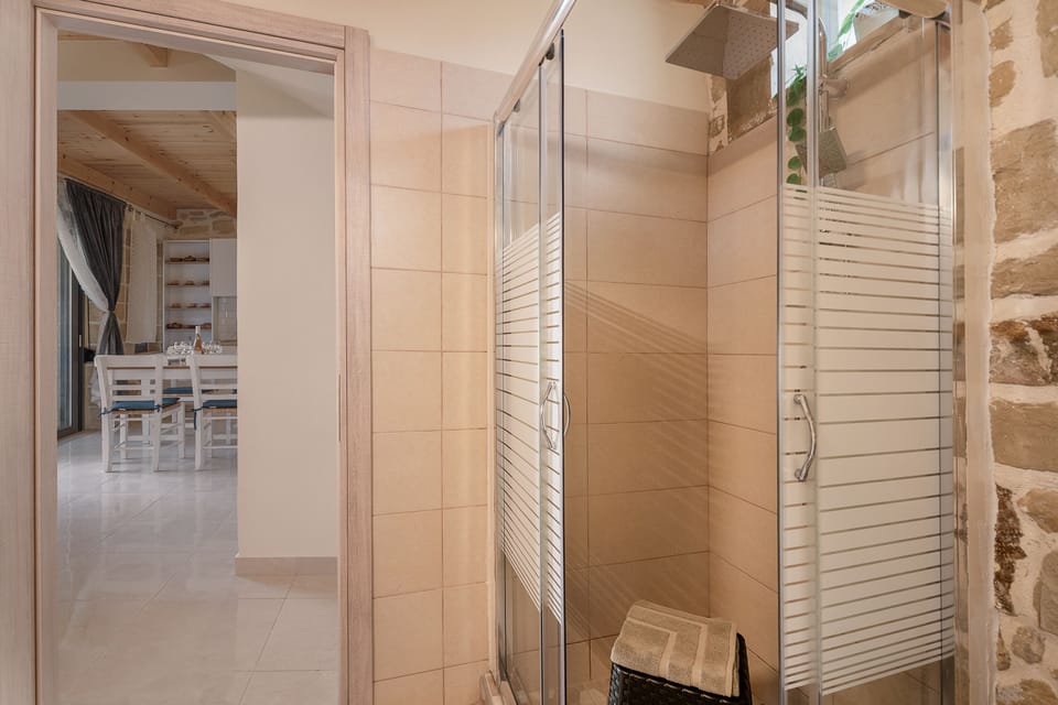 Shower, rainfall showerhead, hair dryer, towels
