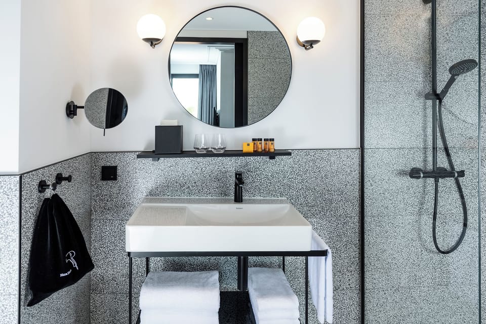Shower, rainfall showerhead, hair dryer, towels