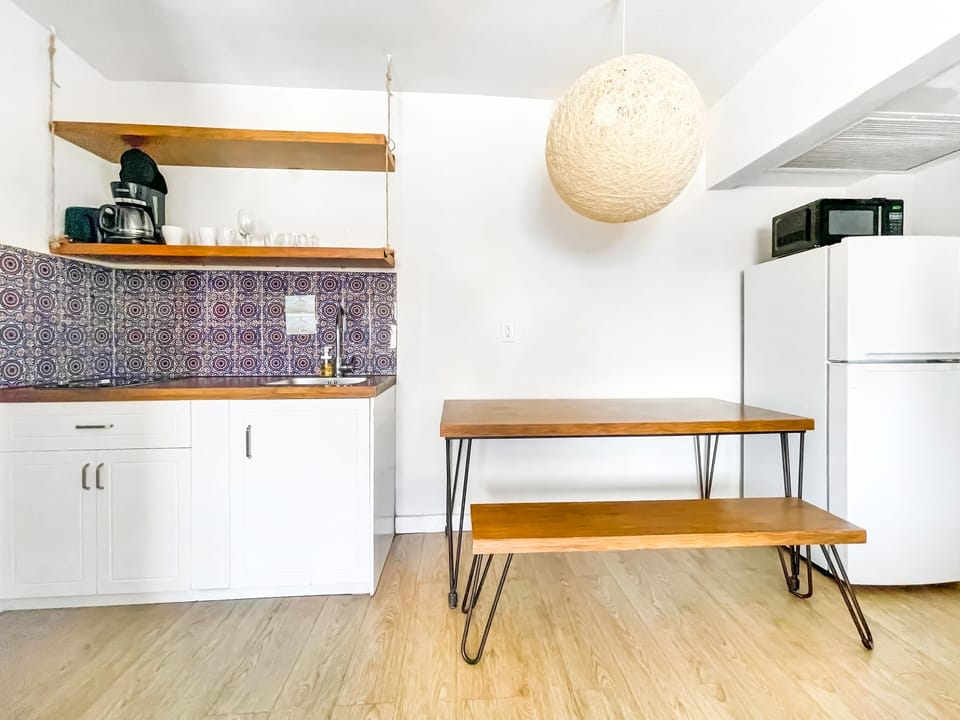 Superior Room, Courtyard View, Beachside | Private kitchen | Coffee/tea maker, full-size fridge, microwave, stovetop