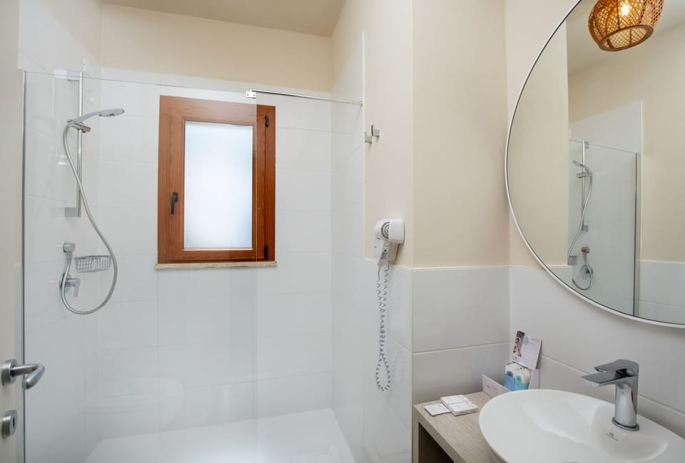 Shower, rainfall showerhead, eco-friendly toiletries, hair dryer