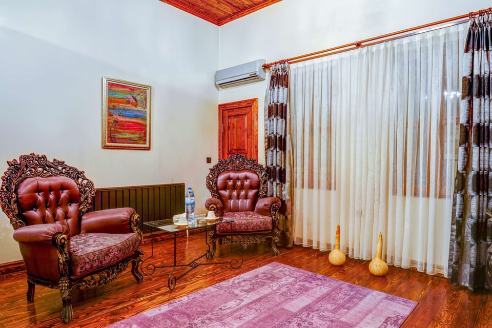 Family Room, 2 Bedrooms | Living area | 180-inch LCD TV with premium channels