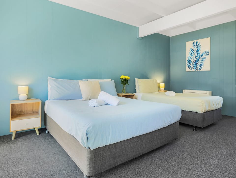 Classic Triple Room | Individually furnished, desk, laptop workspace, blackout drapes