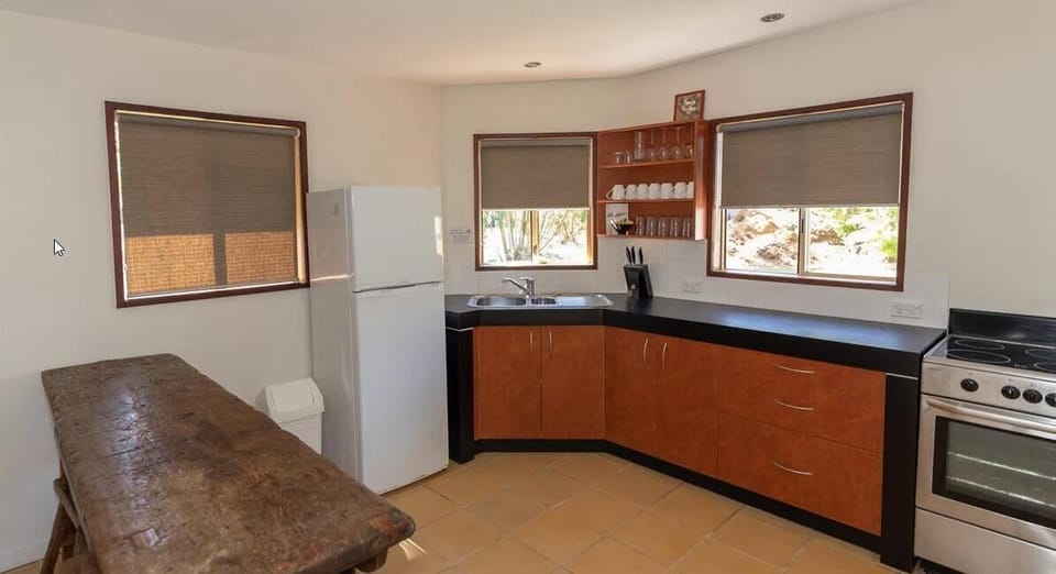 The Pump House (2BR) | Private kitchen | Electric kettle, dining table