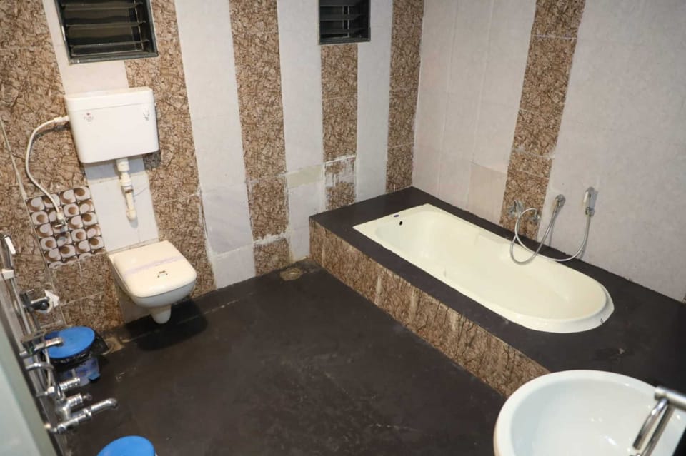 Shower, designer toiletries, hair dryer, towels